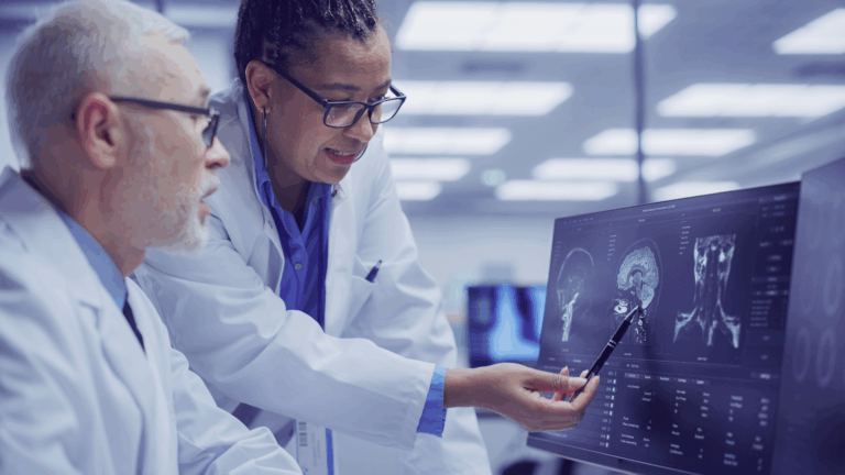 Two physicians looking at x-ray scan together