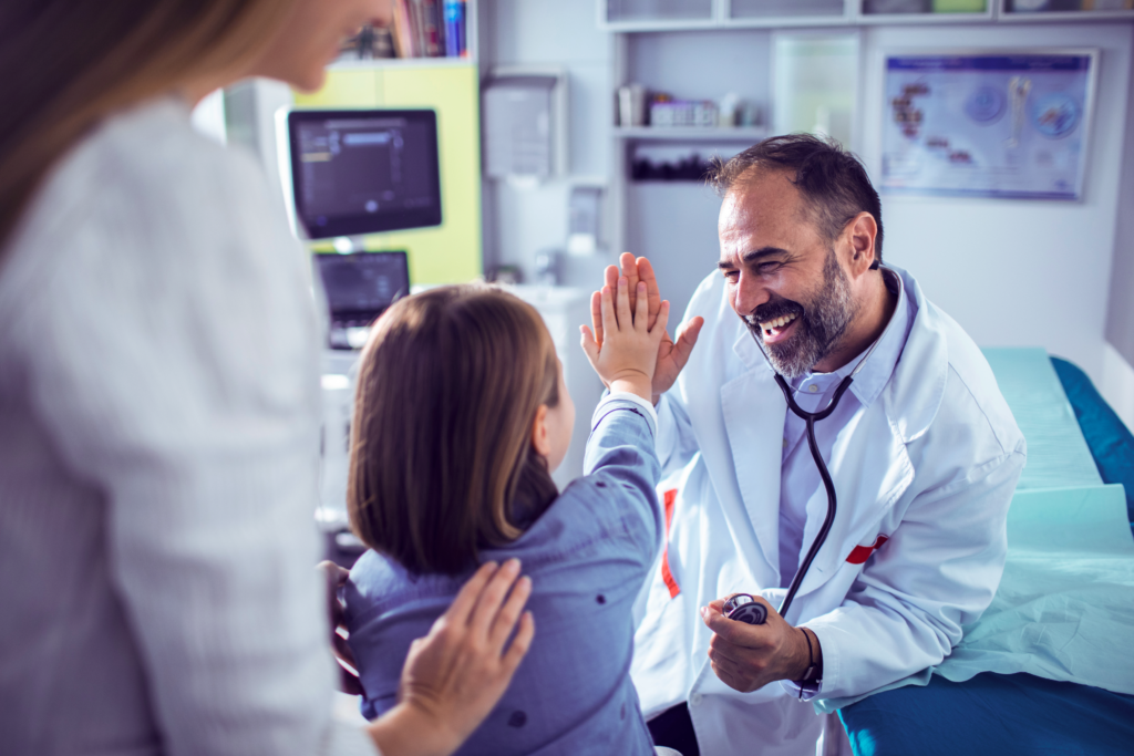 Doctor high fives patient