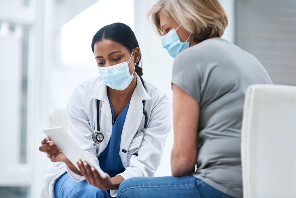 A locum tenens provider consults with a patient.