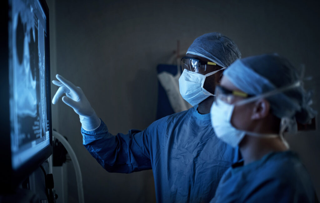 Surgeons analyzing charts during Cardiothoracic Surgery