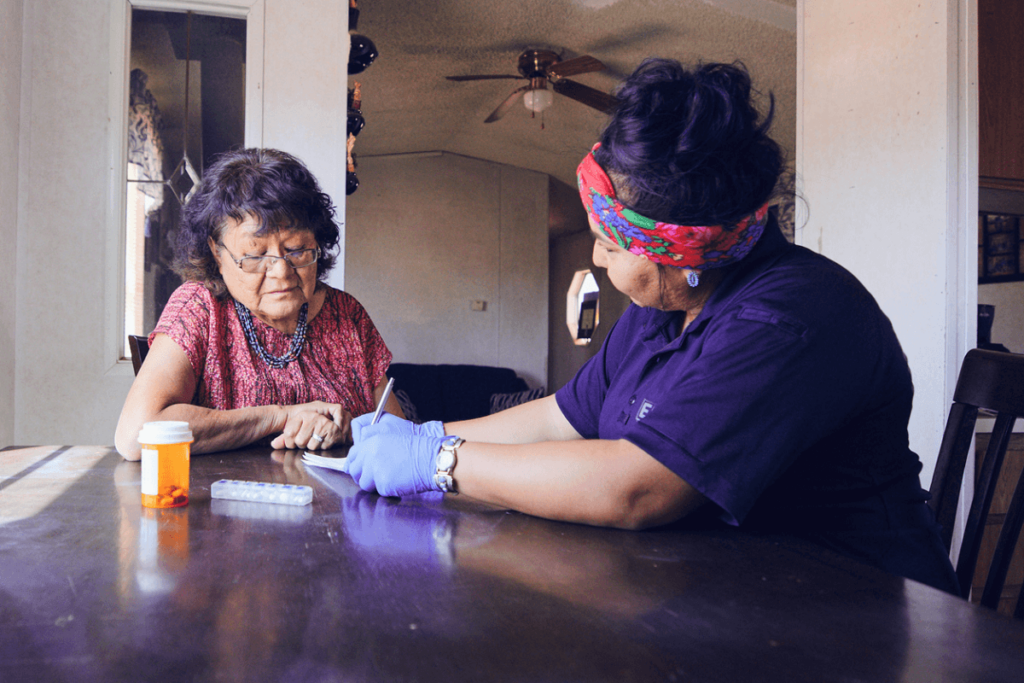 Government health provider with Navajo woman.