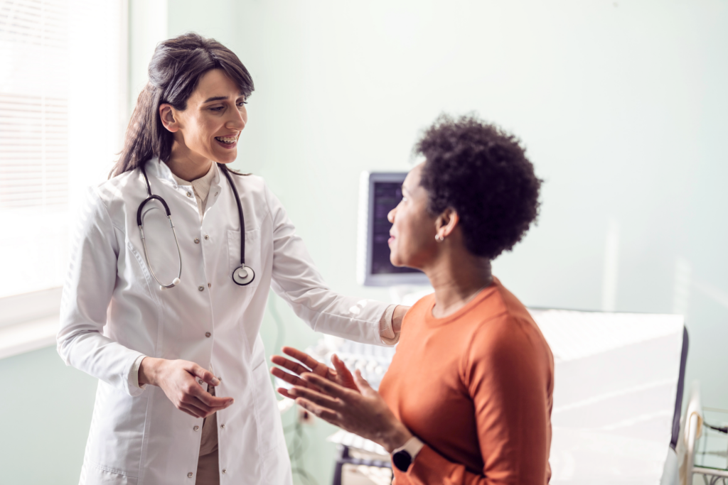 Doctor speaking with patient during appointment