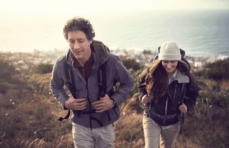 Image of siblings hiking up a mountain