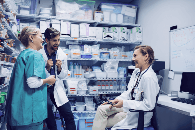 Group of doctors laughing in storage room together