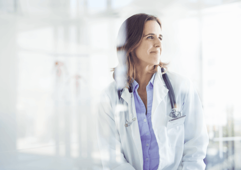 Female doctor looking out and smiling