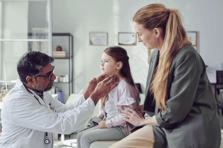 Mon and daughter at pediatric doctor appointment