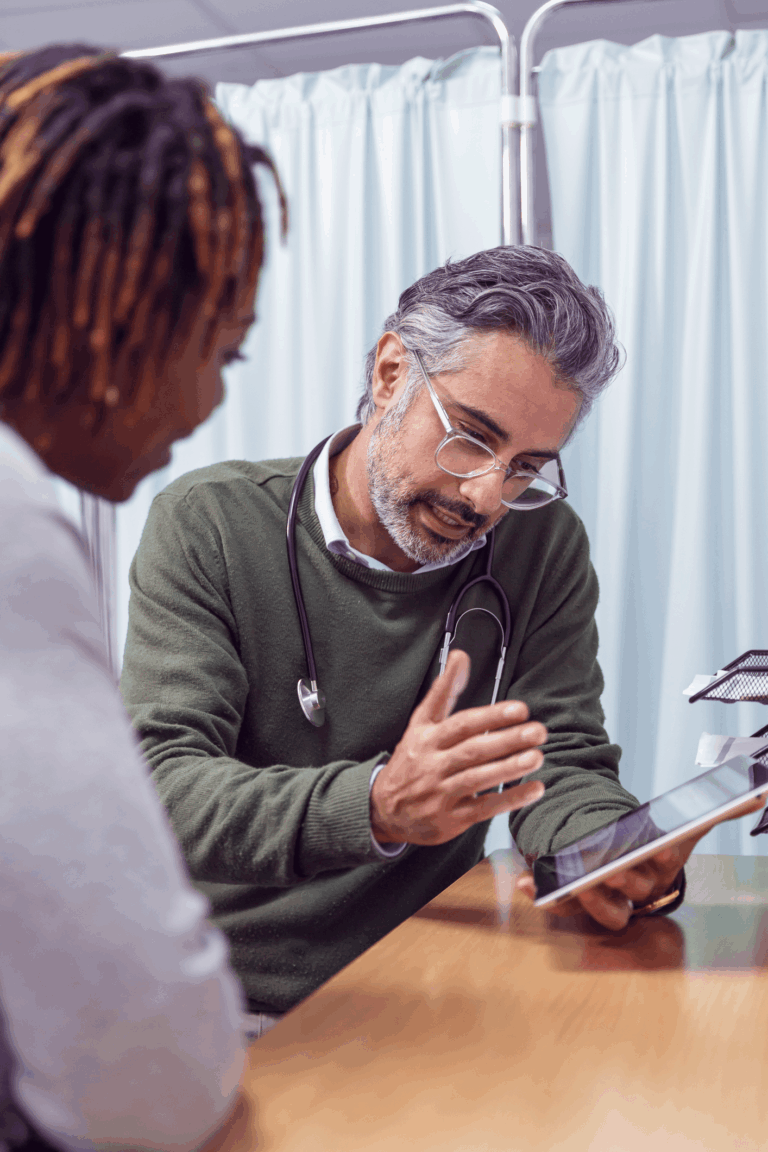 Doctor showing patient tablet screen