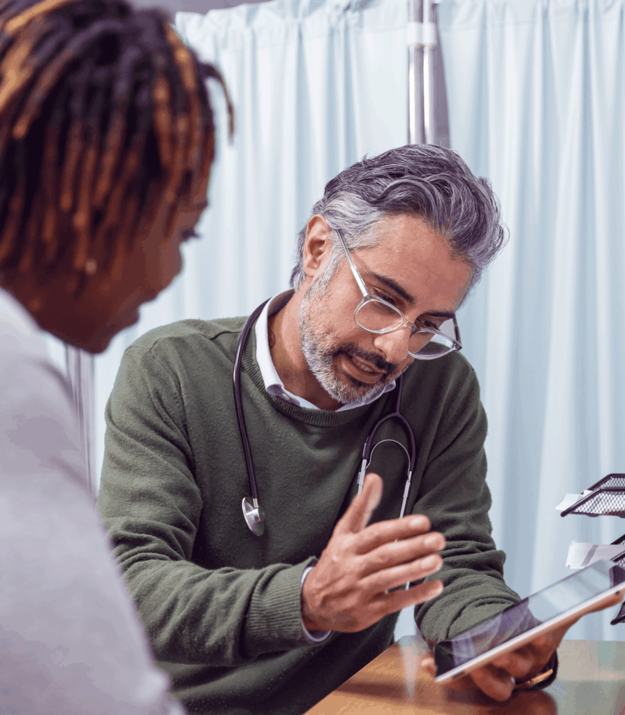 Doctor showing patient tablet screen